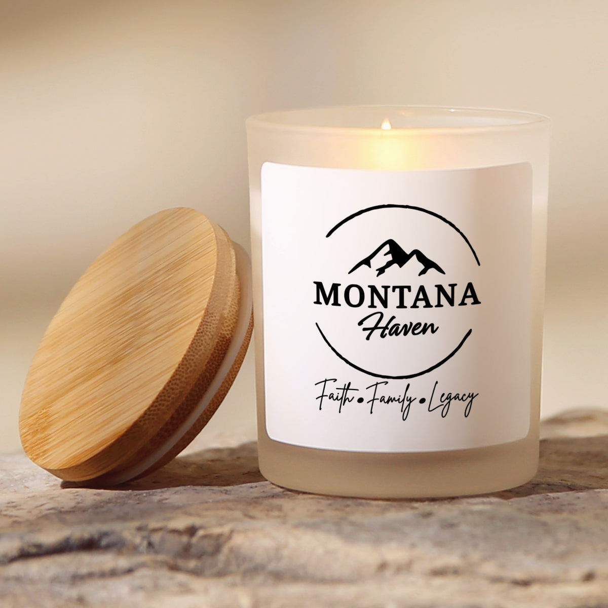 Montana Haven logo soy candle in a frosted jar with bamboo lid