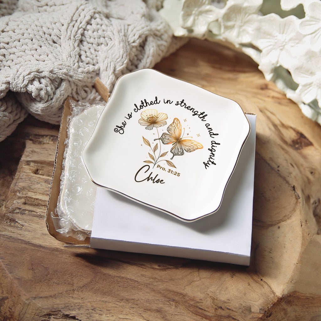 Personalized wavy square ring dish with the name Chloe, resting on its gift box